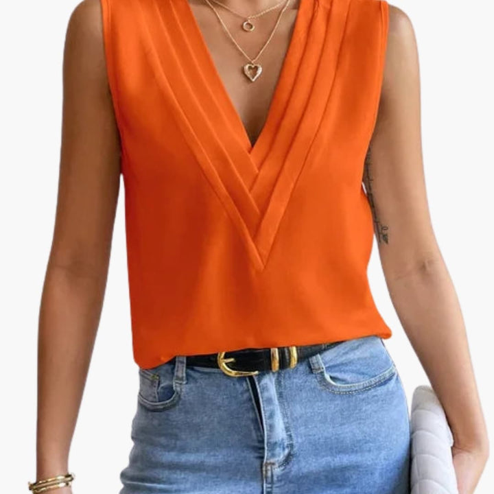 Chic women's V-neck sleeveless blouse, comfortable relaxed fit, essential for versatile summer and professional styling.