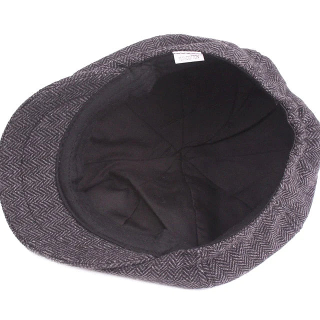 Elegant men's newsboy cap, a classic vintage style baker boy hat enhancing men's fashion.
