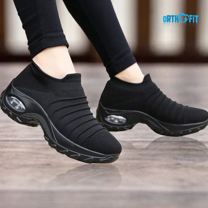 Close-up of women's cushioned orthopedic walking shoes with arch support.