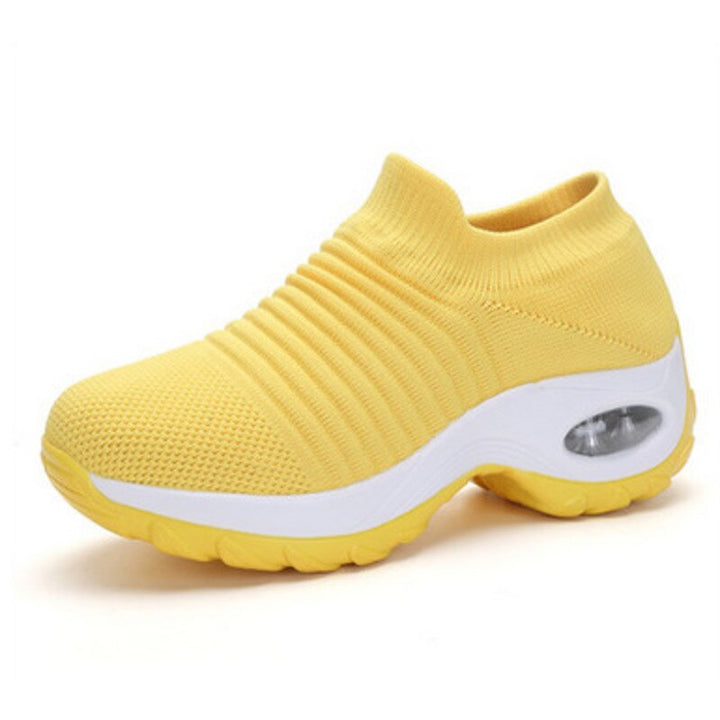A woman wearing lightweight orthopedic shoes with superior arch support for walking.