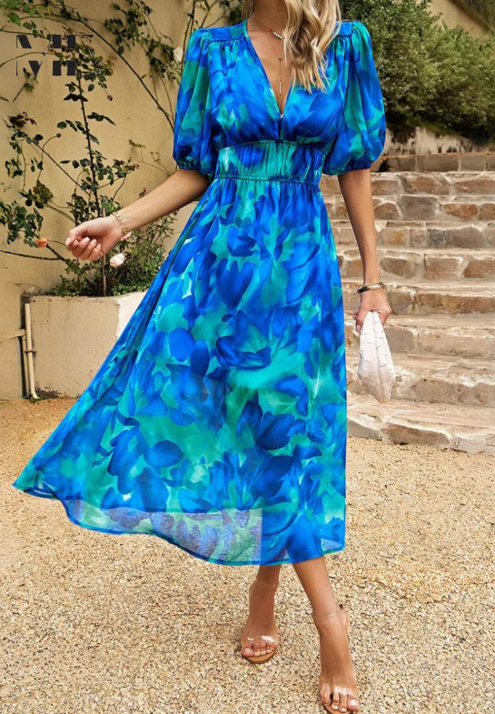 Back view of Women's Floral Print Midi Dress, highlighting the flowy flared skirt and comfortable fit.