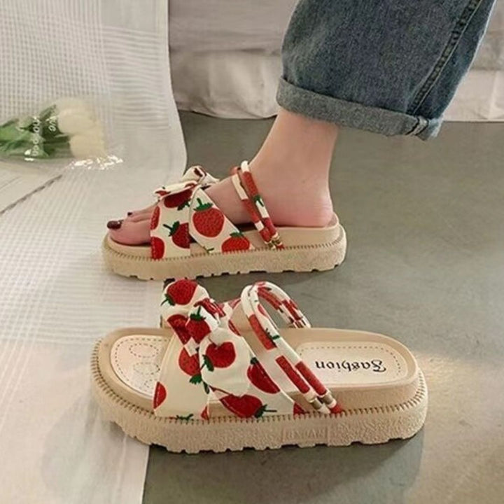 Open-toe women's comfortable sandals with adjustable straps for easy slip-on summer style.