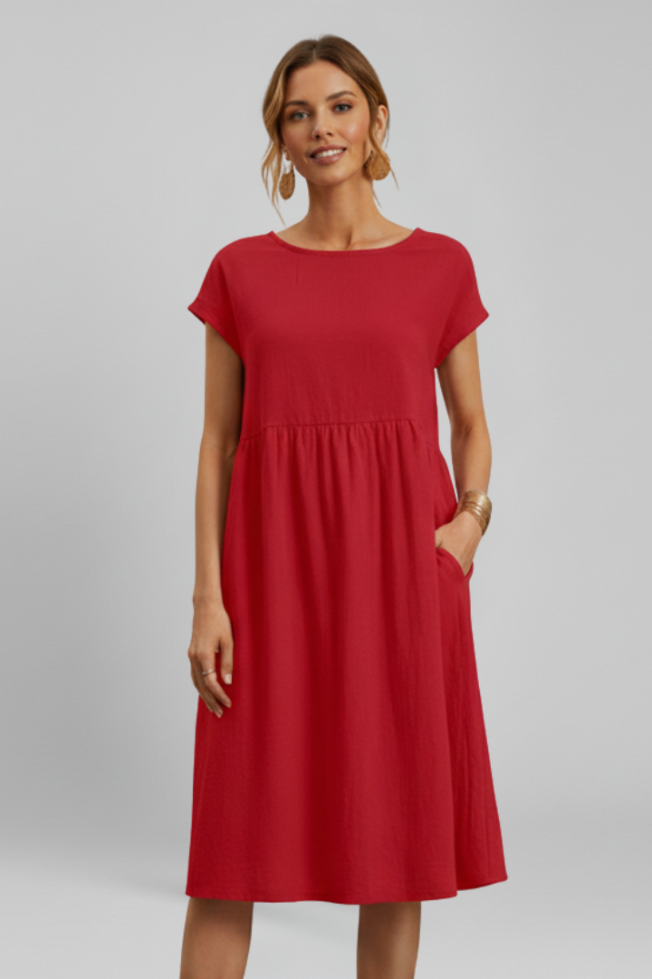 Women's everyday knee-length dress, comfortable and chic, with round neck, short sleeves, and pockets.
