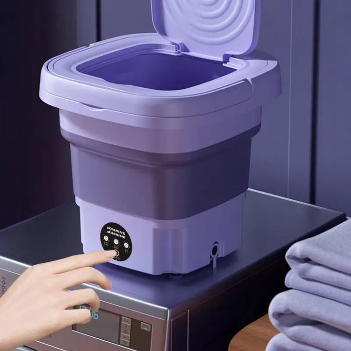 Compact foldable portable washing machine with spin dryer; small, efficient design, perfect for travel, apartments, or dorms.