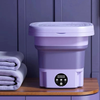 Compact foldable portable washing machine with spin dryer; small, efficient design, perfect for travel, apartments, or dorms.