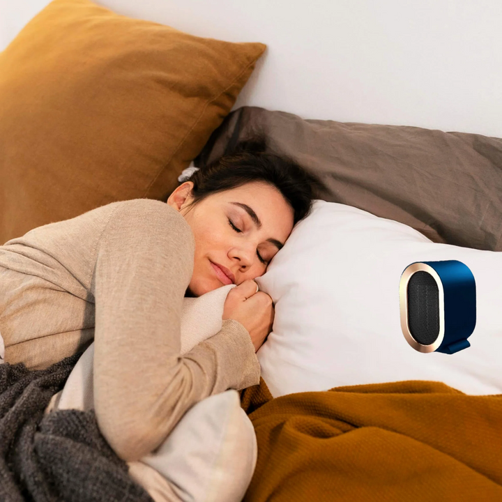 "Compact portable electric heater with energy-efficient ceramic element, ideal for heating small spaces, shown in stylish des