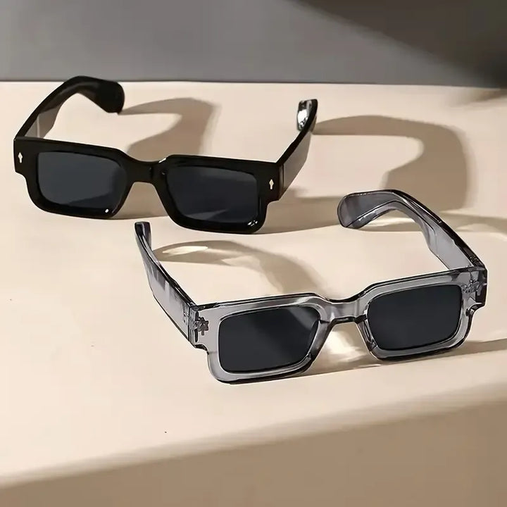 Close-up of Corvella men's rectangular sunglasses, gray lenses, sleek acetate finish, stylish accessory