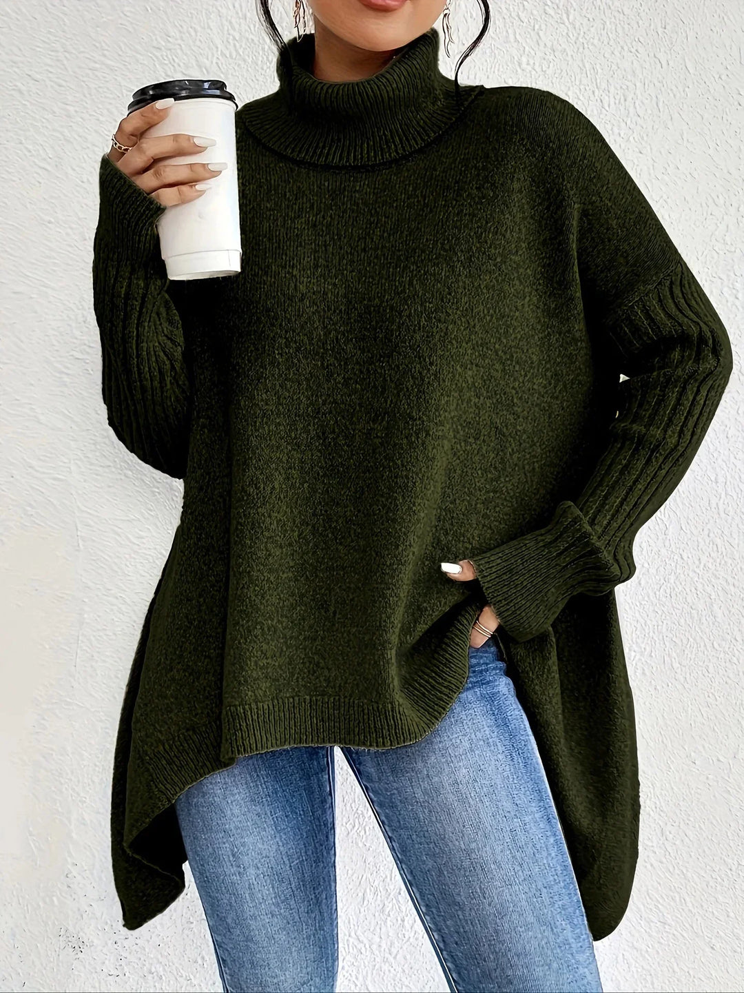 Cozy women's black asymmetrical turtleneck sweater, perfect for fall fashion.