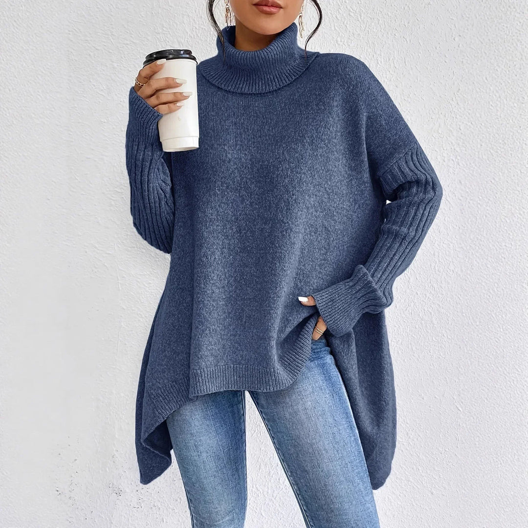 Relaxed fit knitwear: women's chunky turtleneck sweater with unique asymmetric hem.