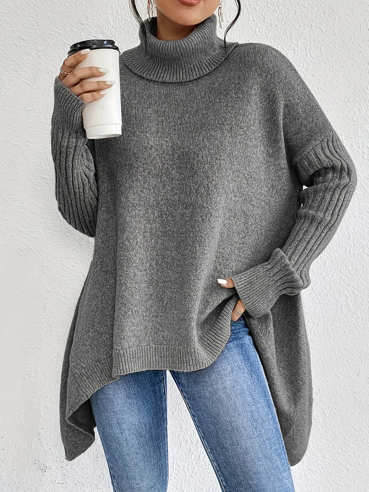 Stylish women's asymmetrical turtleneck sweater in a soft, black knit.