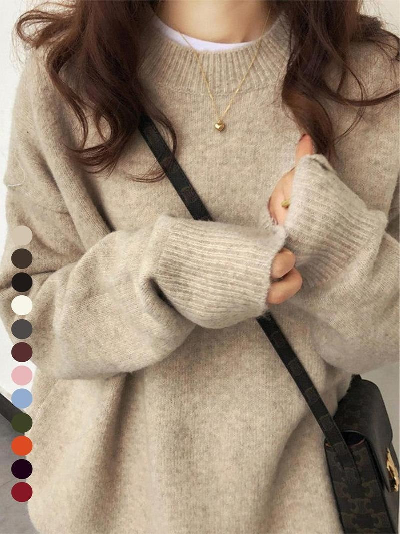 Close-up of the soft brushed knit texture on a women's relaxed fit pullover sweater, cozy and warm
