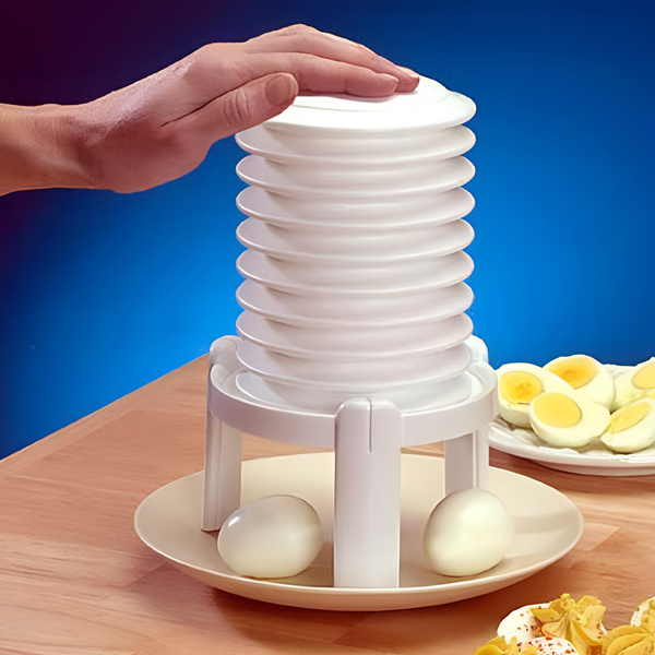 "Creative egg peeler tool for quick, safe shell removal; efficient kitchen gadget with sleek design and compact portability."