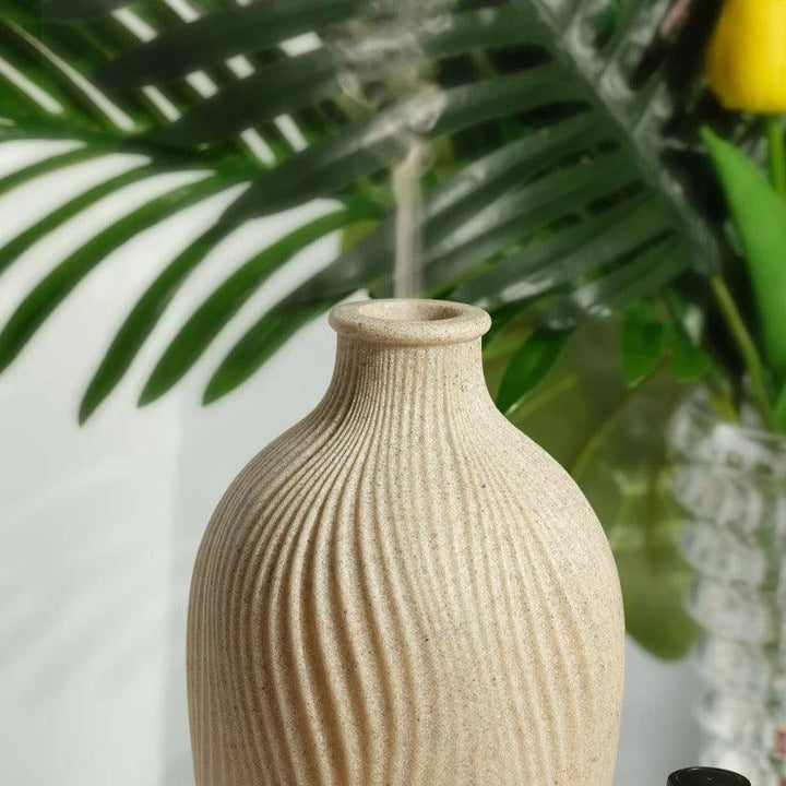 Sleek office decor aromatherapy diffuser & humidifier, boosting focus, relaxation & air quality.