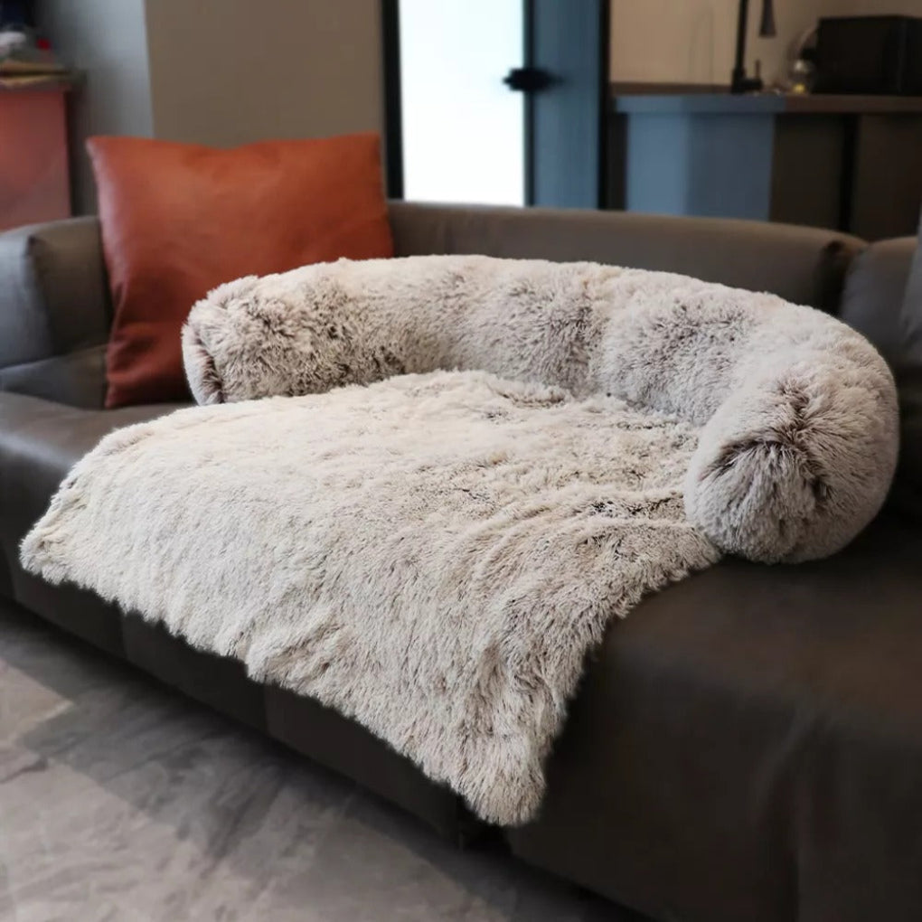 Anti-anxiety dog bed with supportive bolster & soft faux fur for deep sleep. A comfy, washable pet supply for all dogs.
