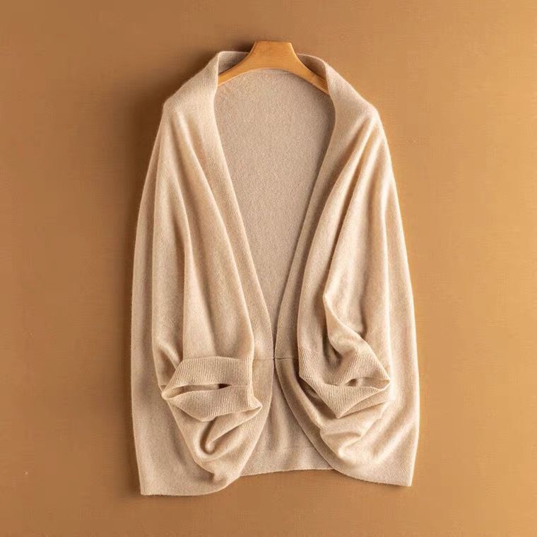 Soft black knit shawl wrap, an elegant and warm addition to a woman's wardrobe.