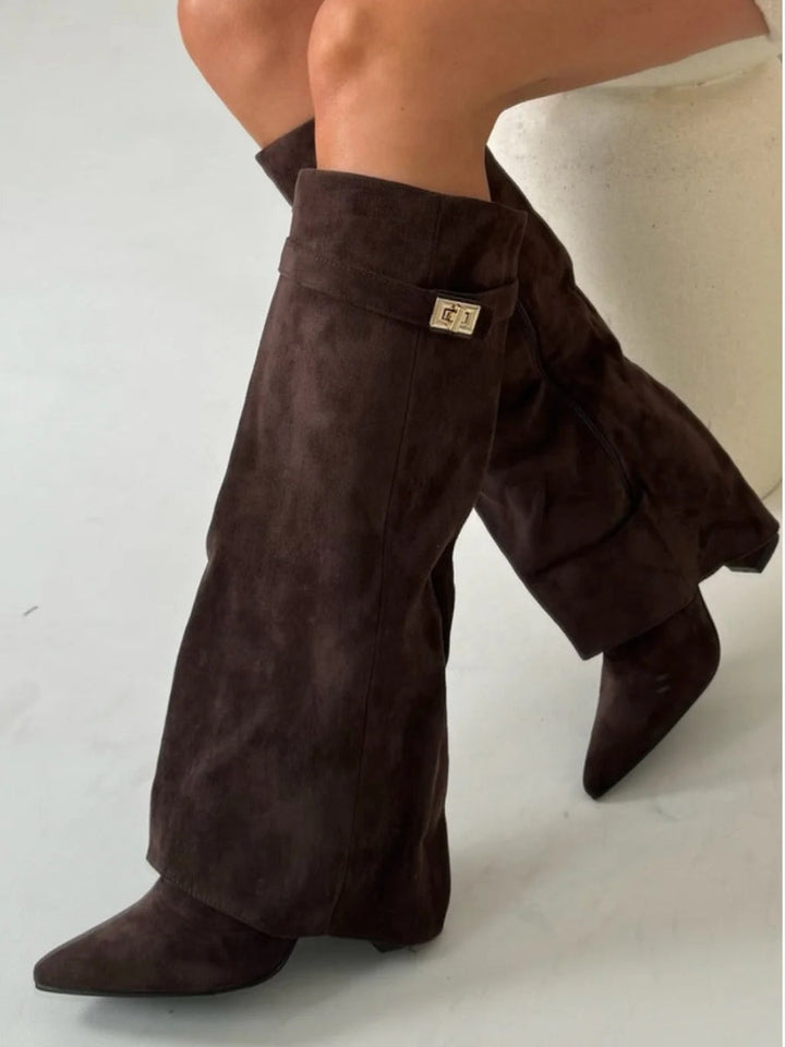 Winter-ready women's black leather thigh-high boots with secure buckle closures.