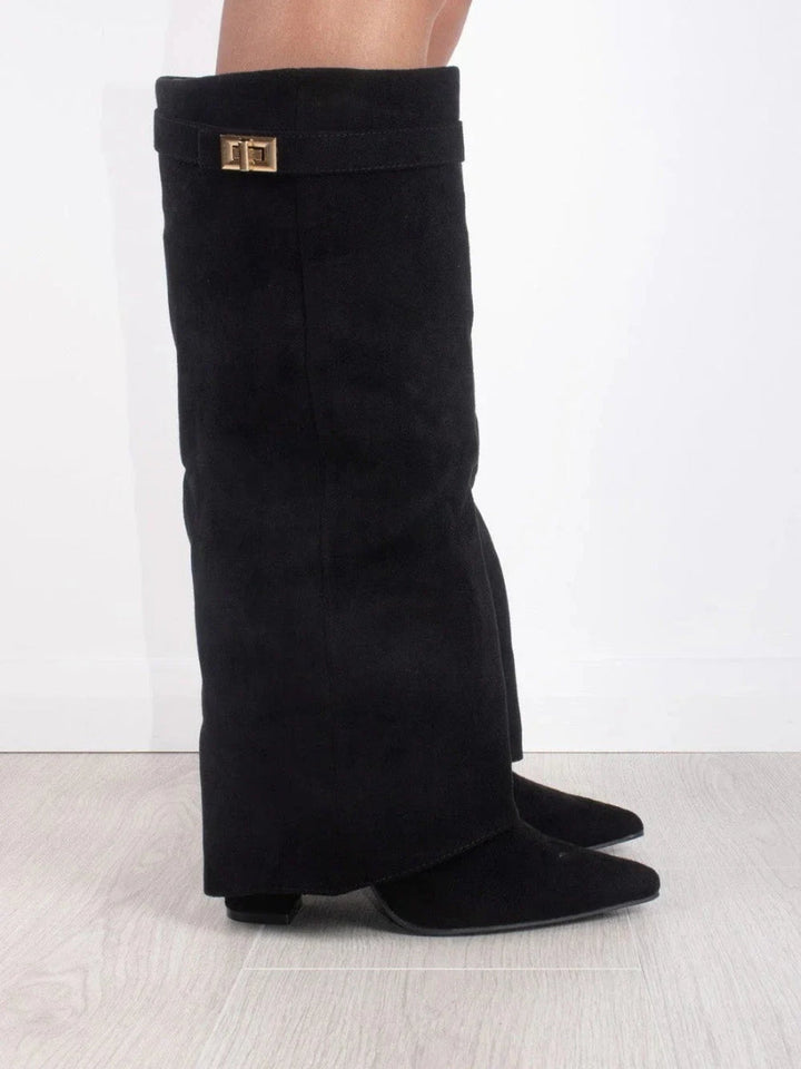 Women's sleek leather thigh-high boots, featuring decorative buckles, ideal for fashion-forward outfits.