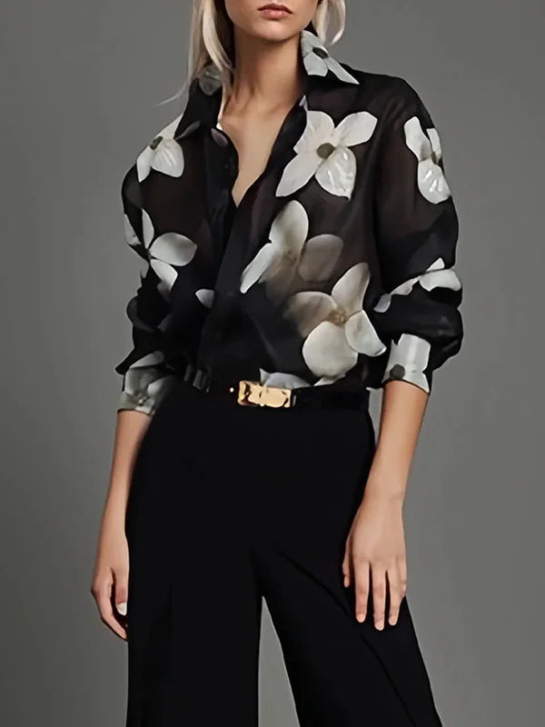 Elegant black long-sleeve women's blouse, perfect for office wear or sophisticated casual chic style. Versatile top.
