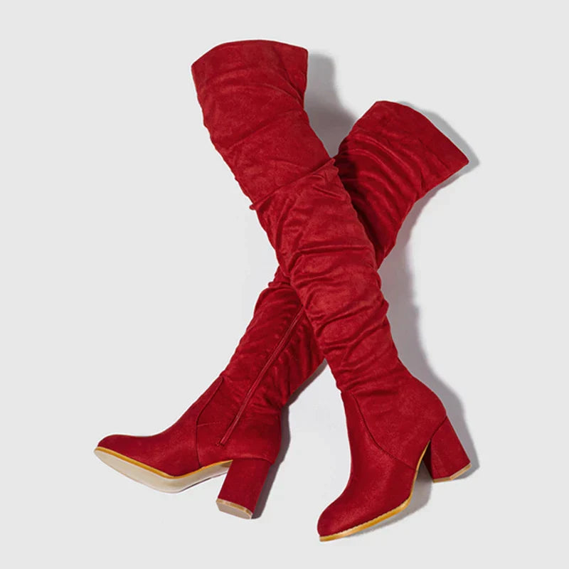 Fashionable black heeled boots for women, designed to be worn over the knee for a bold statement.