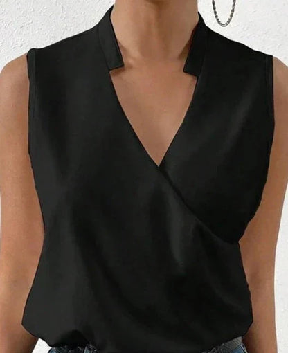 Elegant black sleeveless women's top, flattering fit, highlighting shoulders, ideal for casual or formal occasions.