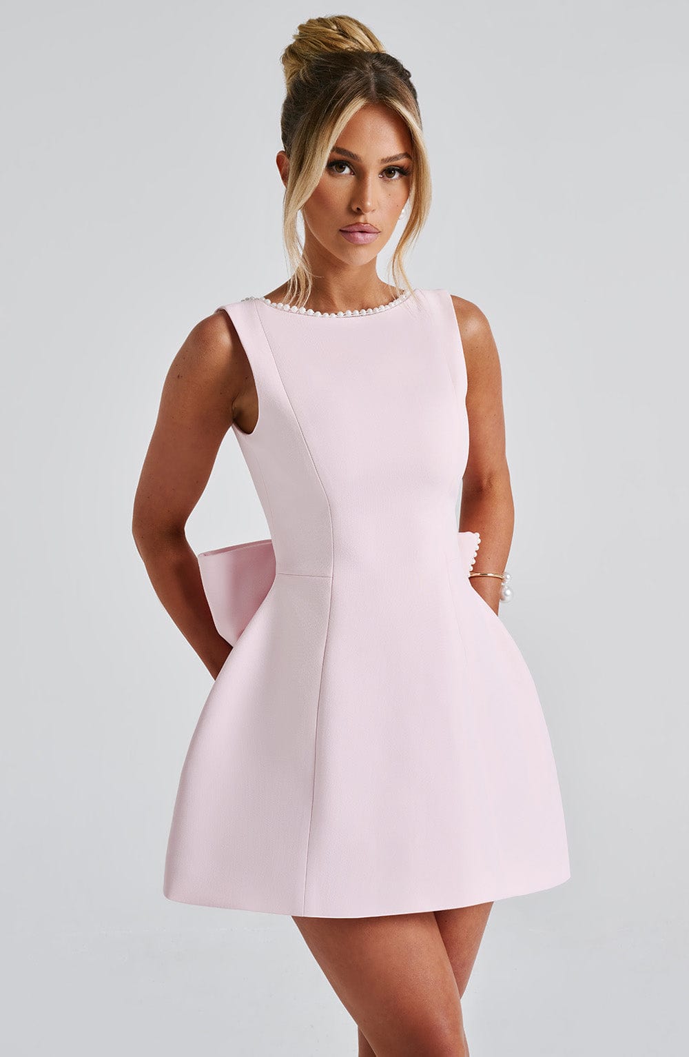 Elegant black structured mini dress for women, perfect for chic party and evening wear.