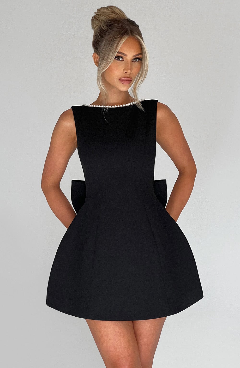 White tailored elegant mini dress for women, a structured design suitable for parties.