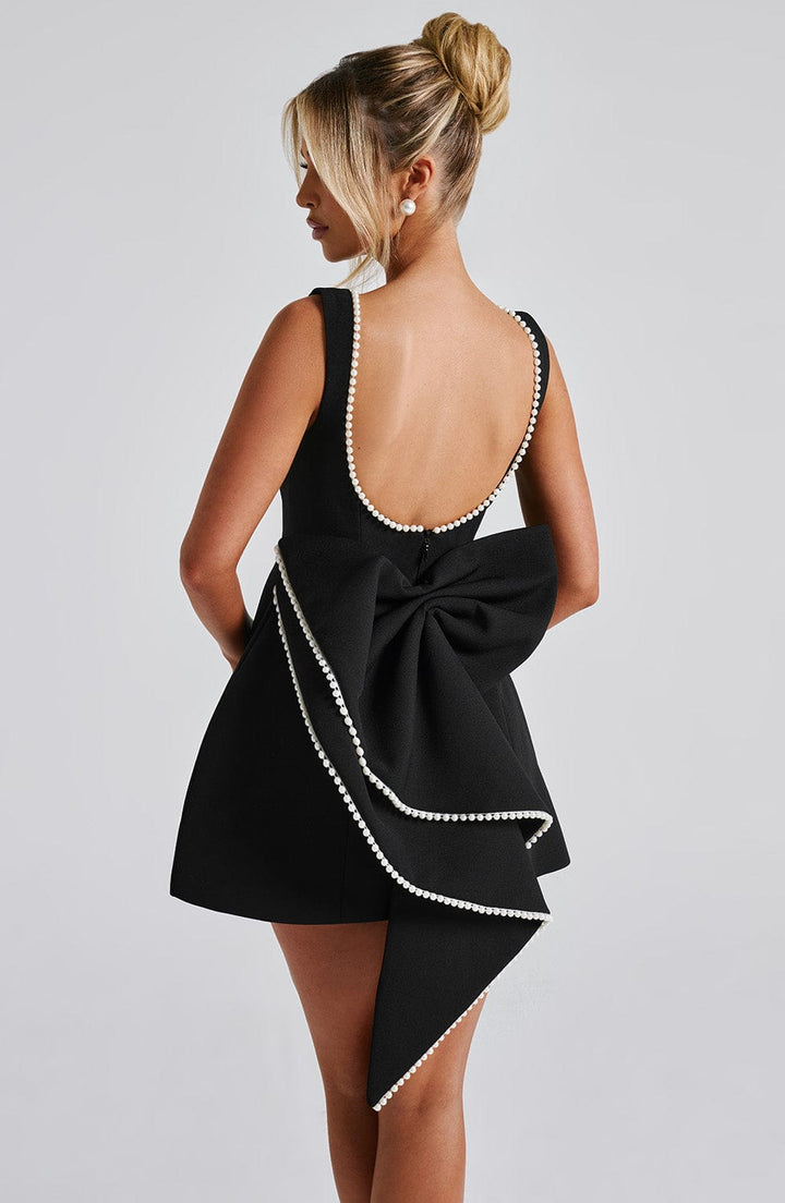 Women's sleeveless structured party dress, a chic elegant mini for evening events.
