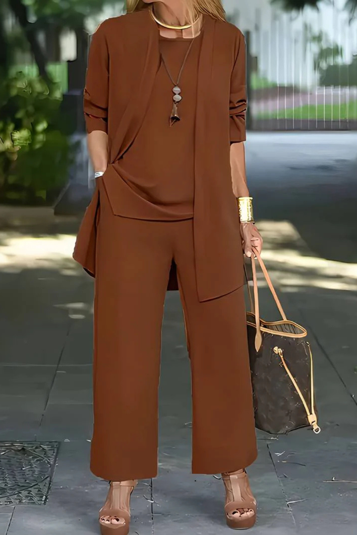 Luxurious fabric detail of an elegant women's 3-piece suit, emphasizing quality formal wear.