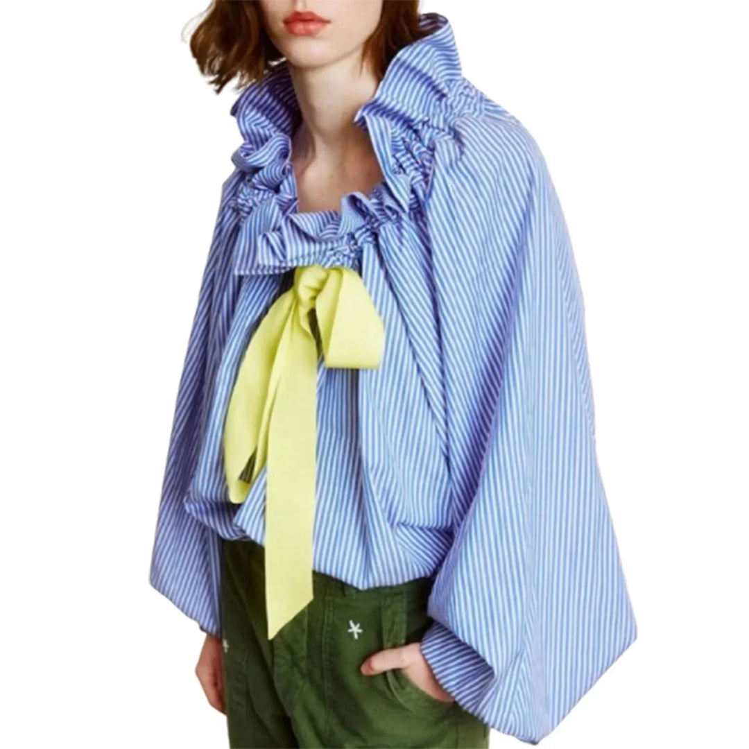 An elegant women's white blouse with comfortable cotton blend fabric, puffed lantern sleeves, and bow tie.