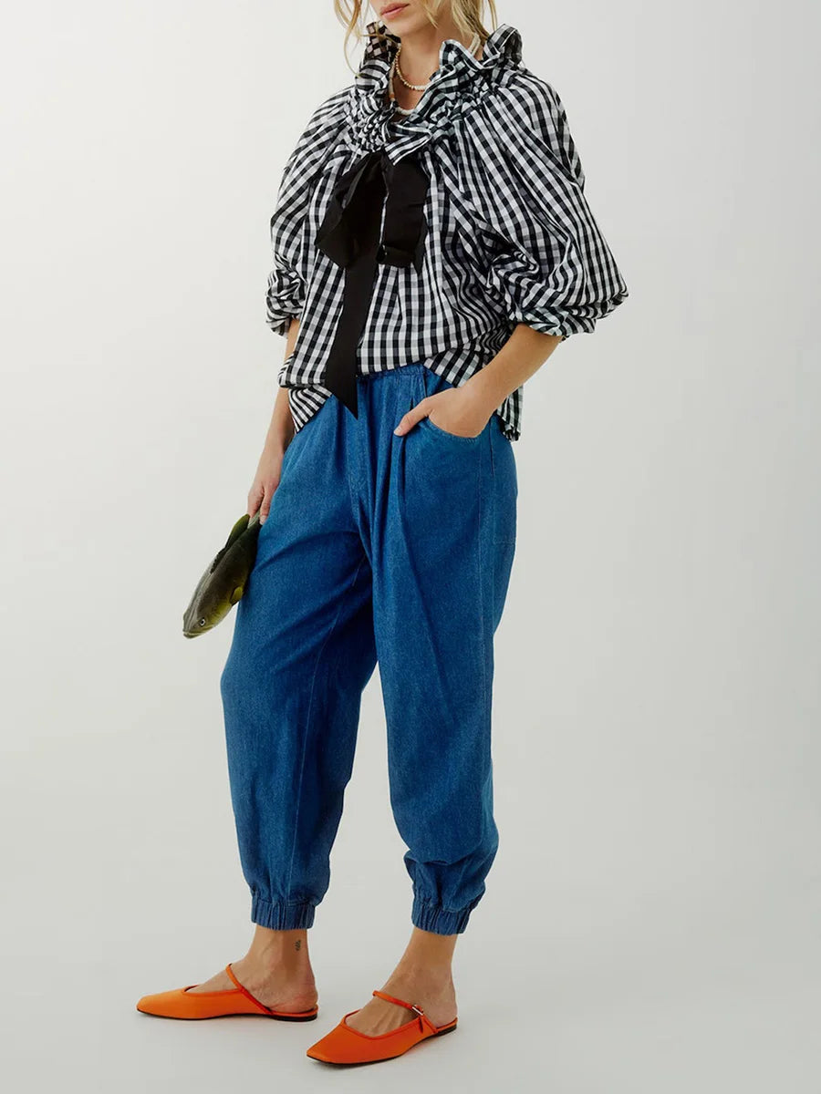 White women's top with elegant puffed lantern sleeves, ideal for sophisticated fashion and blouses.