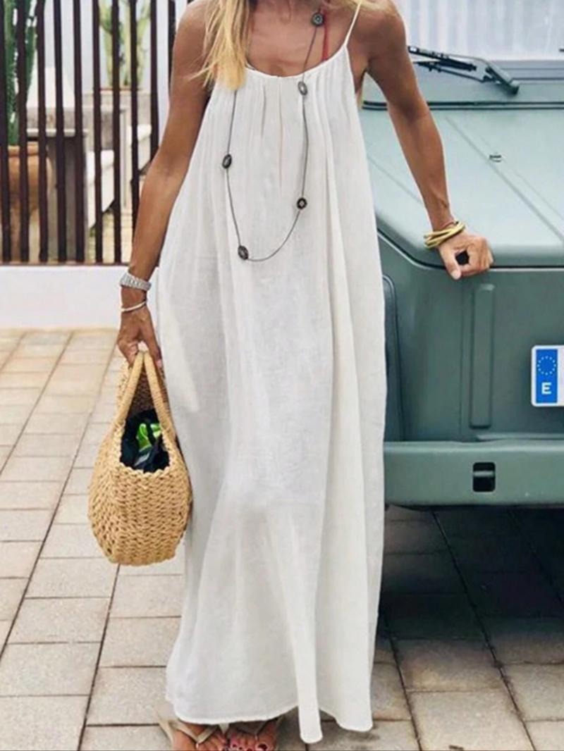 Full length image of a backless cotton-linen maxi dress, exuding a chic, flowy summer vibe.