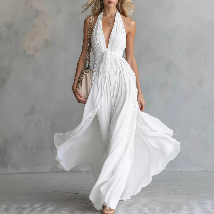 Ladies' stunning halter maxi dress, backless design & graceful pleats. Ideal for summer vacations or evening wear.
