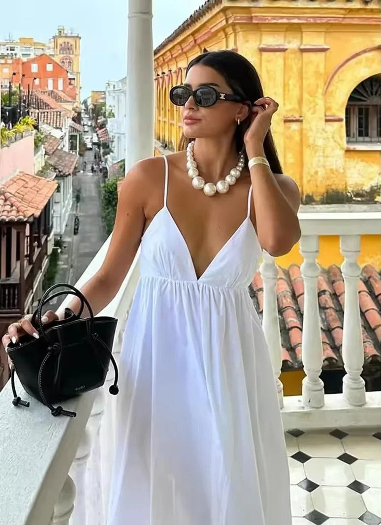Elegant women's backless spaghetti strap maxi summer dress, perfect for beach, vacation or evening wear.
