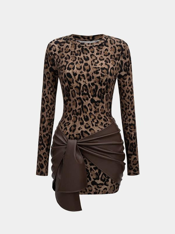 Women's stretch knit midi dress featuring a stylish faux leather accent at the waist for an elegant look.