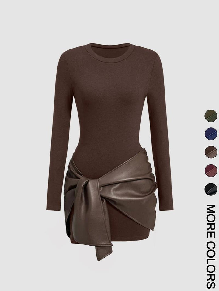 Close-up of the knit texture and faux leather tie detail on a women's elegant fall midi dress.