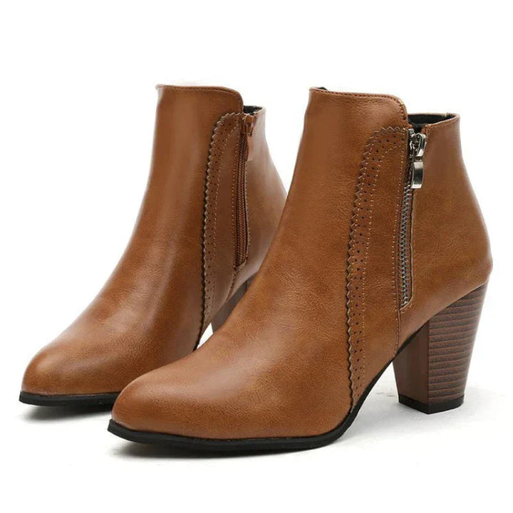 Elegant women's black leather ankle boots with scalloped edge detail, block heel, and side zip, perfect for fall fashion.