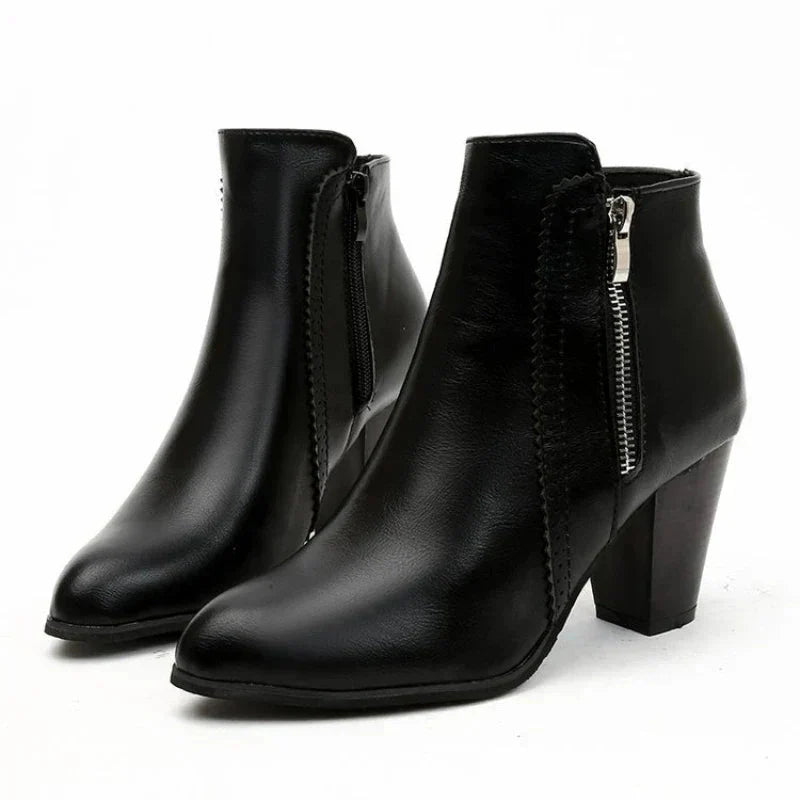 Women's stylish scalloped edge ankle boots in premium black leather, featuring a comfortable block heel for winter.