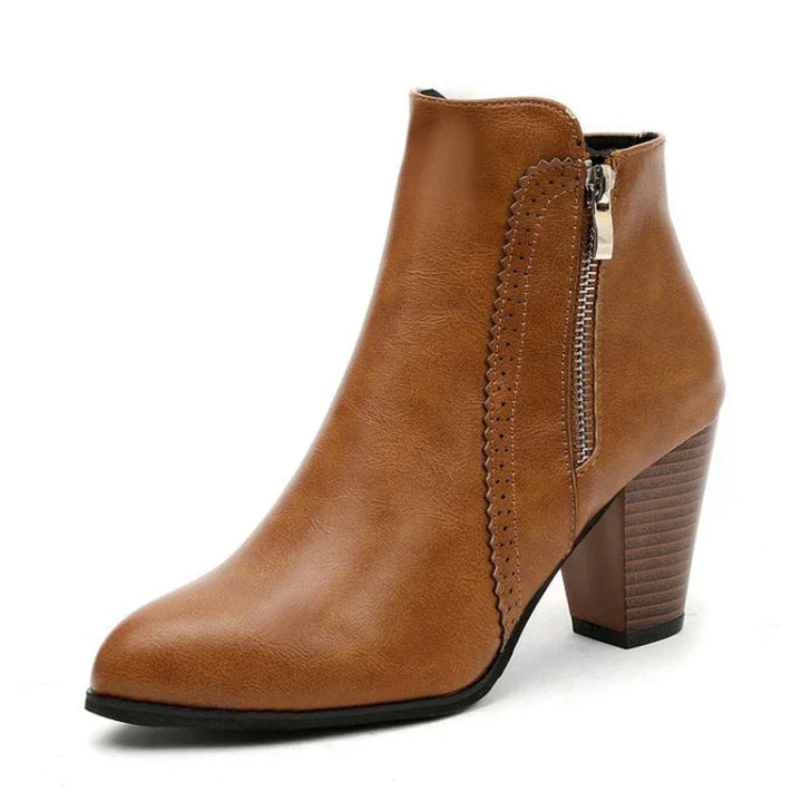 Fashionable women's ankle boots with decorative scalloped edges, smooth leather, and practical side zip closure.