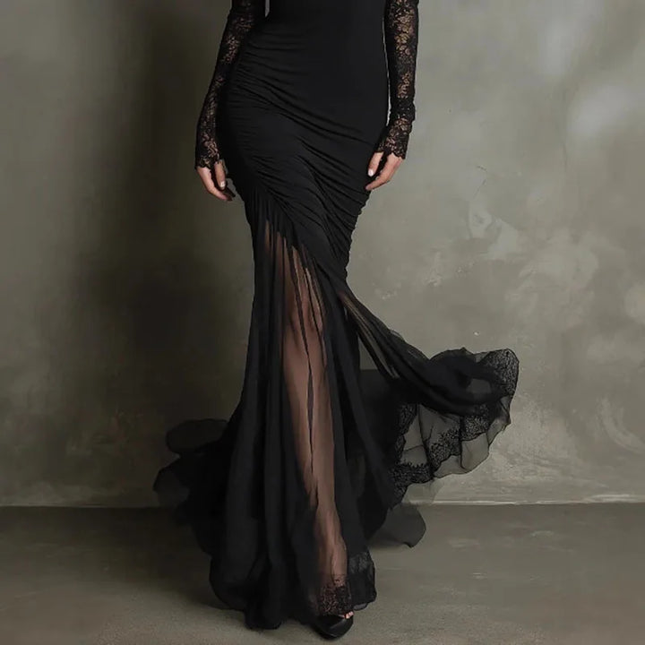 Women's black formal evening gown featuring delicate lace long sleeves and a v-neck, ideal for black tie events.