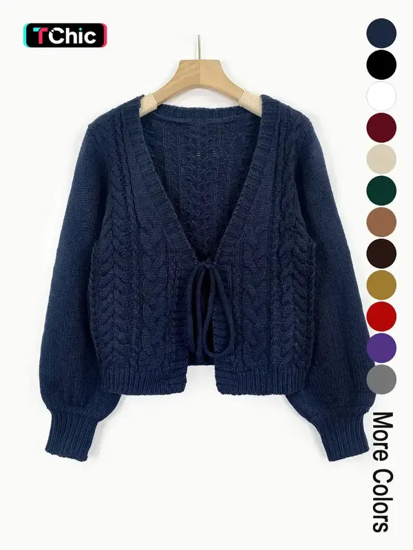 Elegant women's cable knit tie-front cardigan in a cozy acrylic blend, perfect for stylish layering.