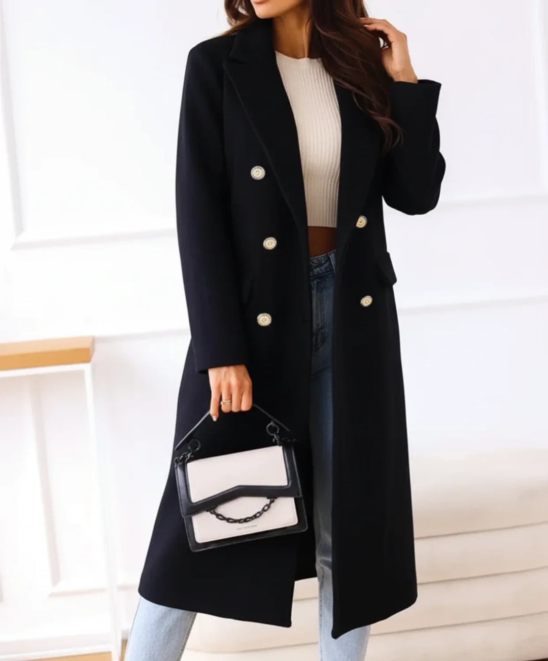 Warm women's elegant blue long double-breasted winter coat. A classic button-up outerwear piece for fall fashion.