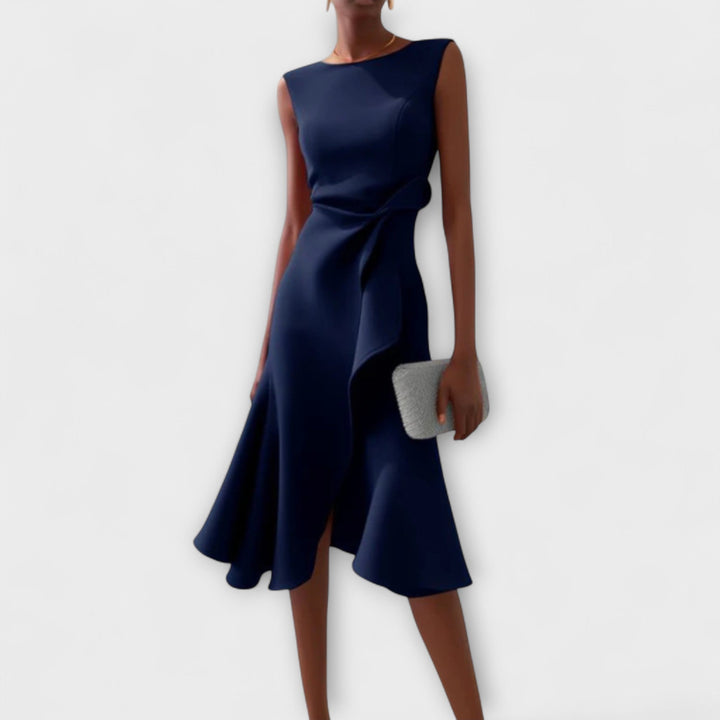 Beautiful sleeveless midi dress featuring cascading ruffles & a draped asymmetric hem for formal events.