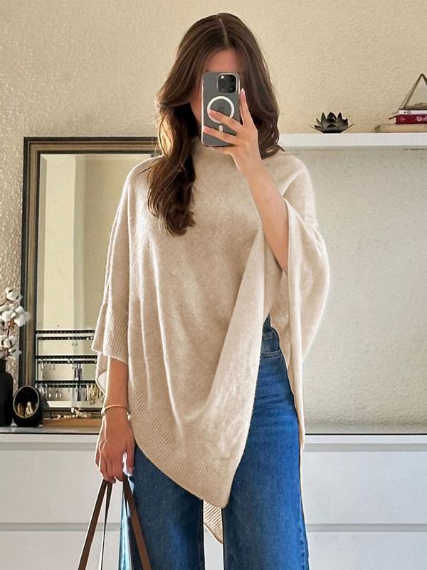 Versatile beige women's draped poncho for effortless style. Elegant outerwear, ideal for comfortable layering.