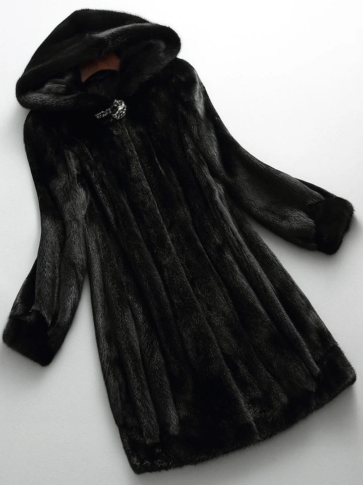 Elegant women's faux fur longline winter coat, plush and warm, perfect for cold weather outerwear