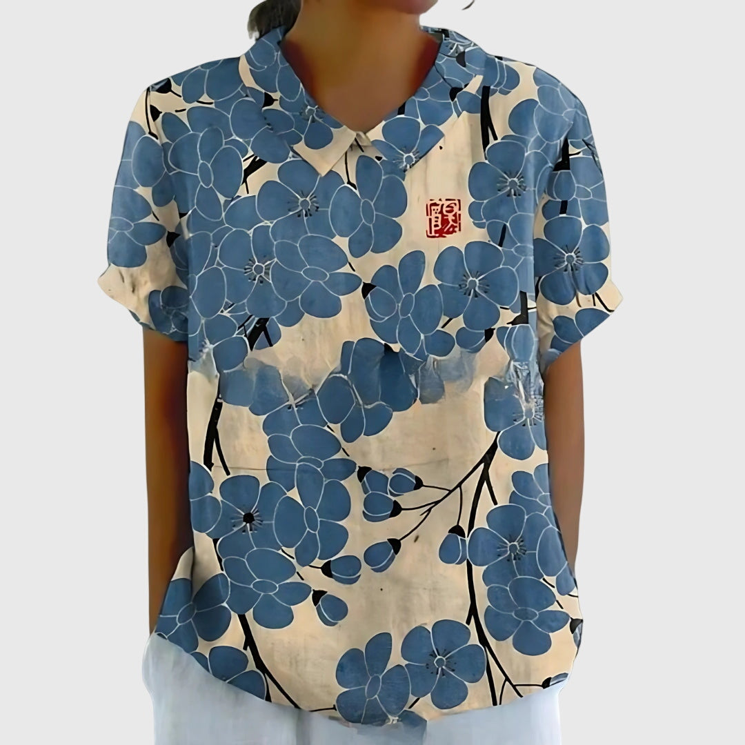 Elegant floral women's top with flattering neckline, comfortable and versatile for everyday wear & style.