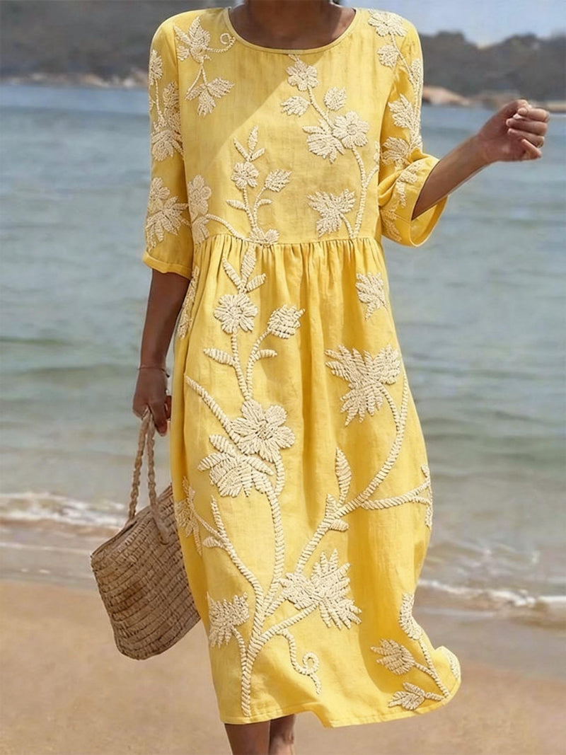 Versatile women's midi dress with intricate floral embroidery & three-quarter sleeves, perfect for elegant or casual style.