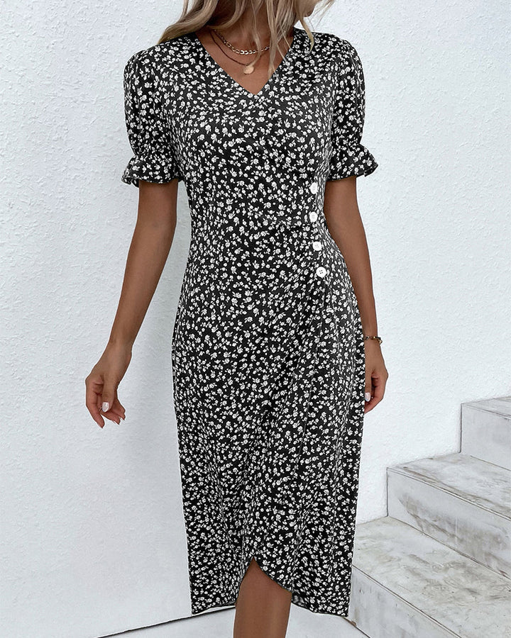 Stylish women's floral V-neck flowy midi dress, captured from a flattering angle. Elegant summer fashion.