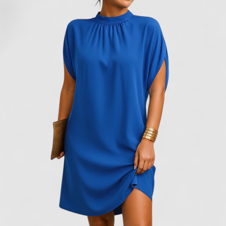 Graceful women's flowy maxi dress with flattering shoulder cutouts, a chic and comfortable option for any occasion.
