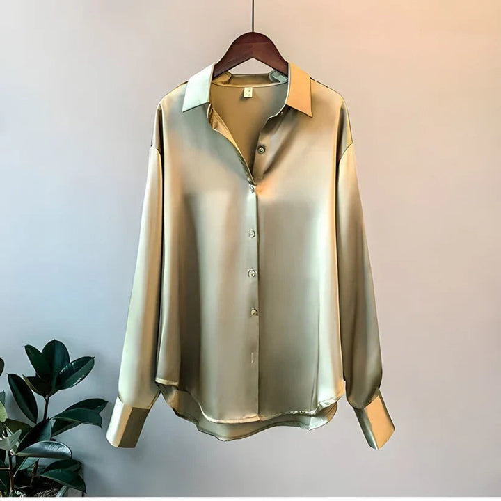 Luxurious women's oversized button down blouse with long sleeves, offering a relaxed fit for stylish comfort.