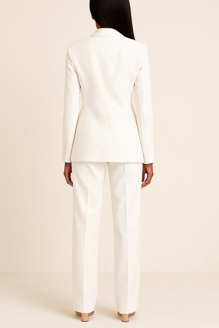 Modern women's elegant suit set: a long, sharp blazer and comfortable, tailored formal trousers for work.